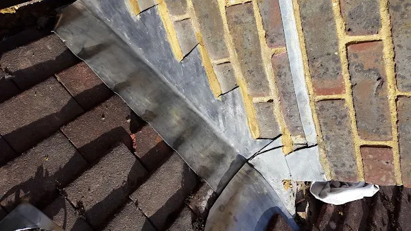 New lead flashing installed around brickwork